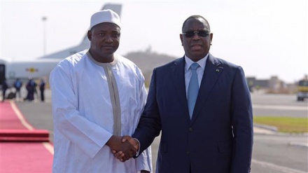 Gambia’s Barrow arrives home from Senegal