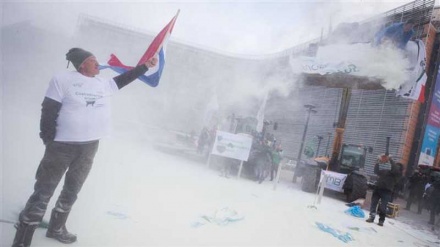 Angry dairy farmers spray EU headquarters with milk powder