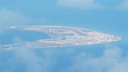 China builds new military facilities on reef in disputed South China Sea: Group