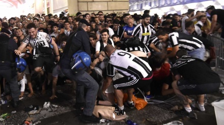 Debandada na final da Liga dos Campeões provoca mais de mil feridos