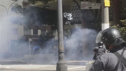 Brazil riot police fire tear gas at protesting teachers