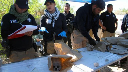 Mexico finds mass graves with at least 166 bodies