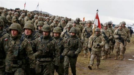 Russia says NATO building up troops along border under guise of drills