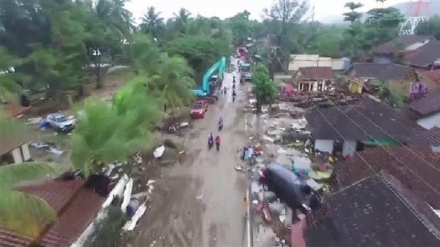 Drone footage shows tsunami aftermath as death toll continues to climb