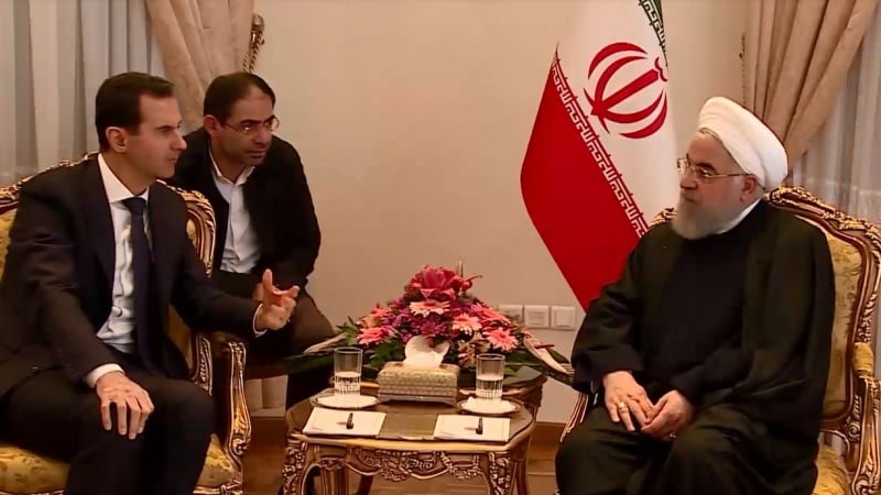 Presiden RII Hassan Rouhani (kanan) dan Presiden Suriah Bashar al-Assad.