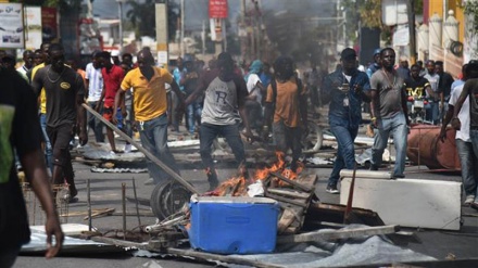 Haitians damage property in angry anti-government protest