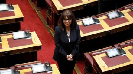 Greece hands reins to first female president