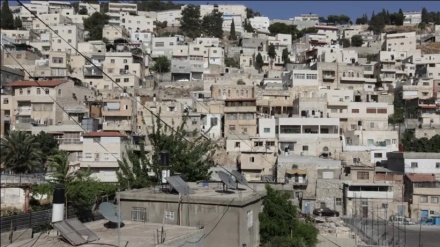 Zionist entity to dispossess 13 Palestinian families in al-Quds, raze their houses