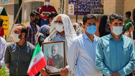 People cast their votes for the 13th presidential election in Kerman
