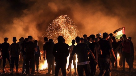 Gazans burn tires near fence for second night to protest Israeli siege