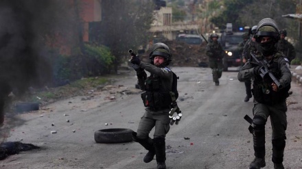 125 Palestinians injured as Zionist settlers, troops raid village in West Bank