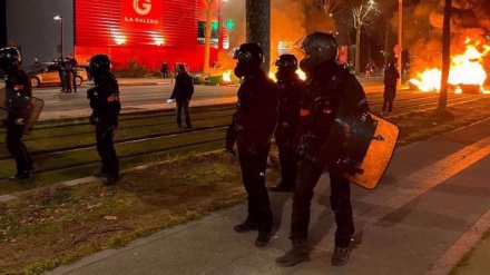 For third night, Paris police clash with protesters demanding President Macron resign