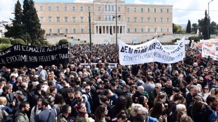 Thousands of protesters clash with police in Greece as anger builds over train deaths 