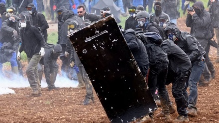 French prosecutor decries police brutality, as protester fights for life