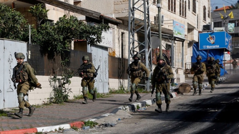 Israeli forces shoot 13 Palestinians, arrest 14 in raid on West Bank refugee camp