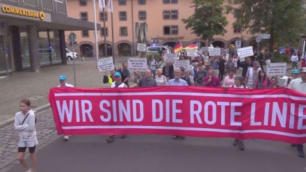  Anti-war activists rally in Germany to protest against arming Ukraine with cluster munitions 