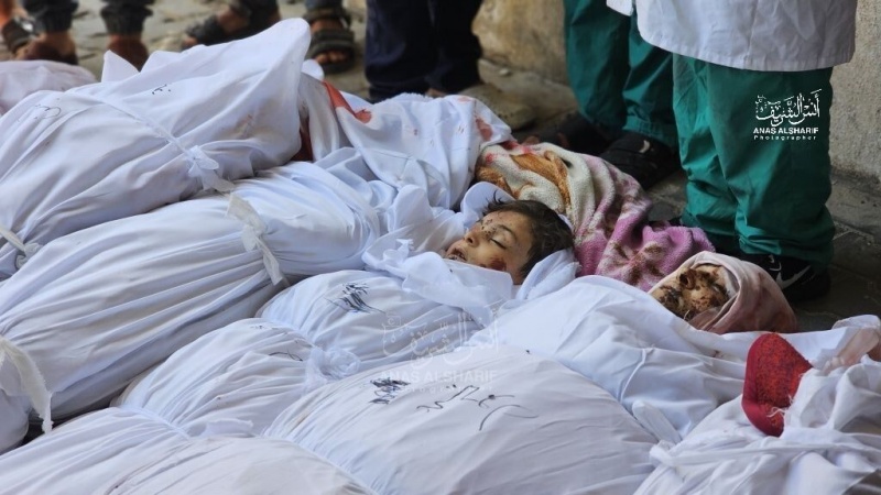 دفن شهدای بیمارستان شفای غزه در گورهای جمعی