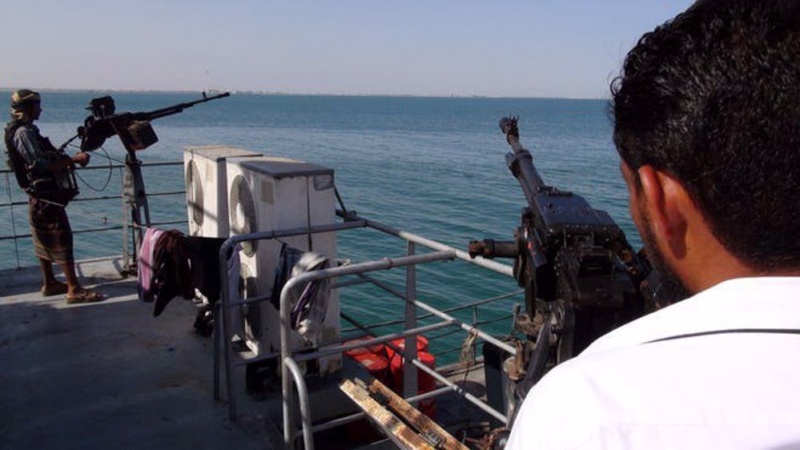 A Yemeni soldier is seen behind a machine gun on a navy ship off the southern coasts in the Gulf of Aden.