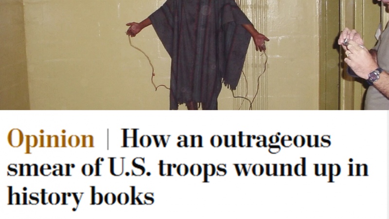 تصویری از یک عراقی به نام عبده حسین سعد فالح در حال شکنجه شدن توسط نیروهای آمریکایی